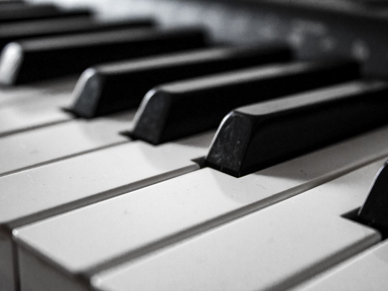 Close-up of hands playing piano keys